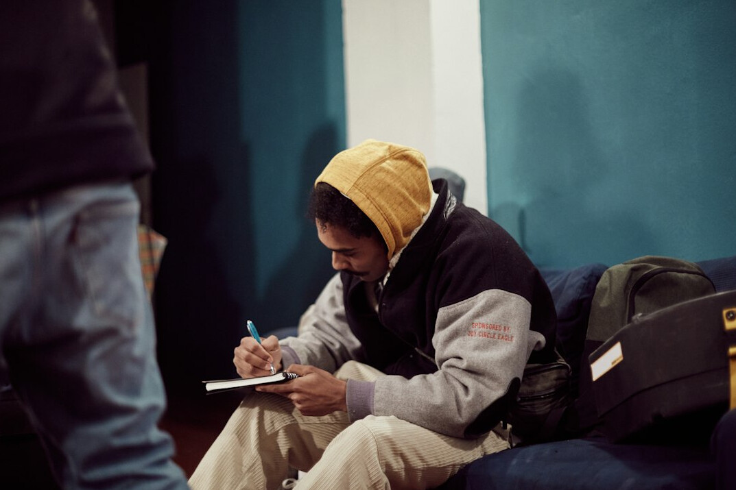 man writing goals