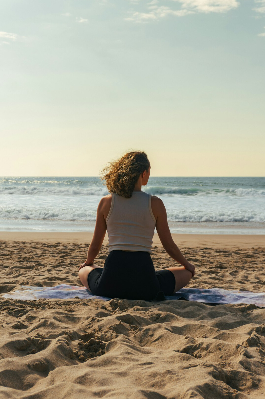 person meditating outdoors